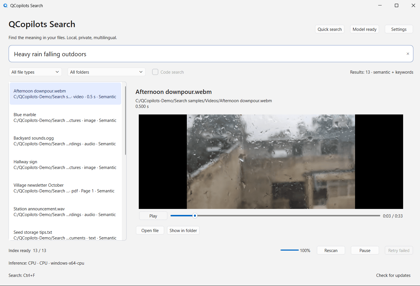 QCopilots Search in English with “Heavy rain falling outdoors” in the search box. The first result is Afternoon downpour.webm, and the preview on the right shows the video at a moment of heavy rain.